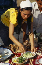 Cambodia, Siem Reap, Angkor Wat, Shaman ceremony preparing the altar with offerings of food