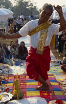 Cambodia, Siem Reap, Angkor Wat, Shaman dancing in a trance at ceremony