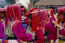 Thailand, Chiang Rai Province, Huai Khrai, Group of young Lisu women in traditional New Year costume.