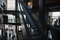Ireland, North, Belfast, Titanic quarter visitor attraction interior with escalators.