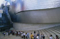 Spain, Basque Province, Bilbao, Queue of people waiting to enter the Guggenheim Museum, designed by Frank Gehry.