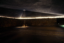 Israel, Jerusalem, Yad Vashem Holocaust memorial and museum interior with eternal flame.