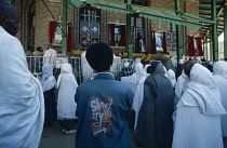 Ethiopia, Addis Ababa, Worshippers at Orthodox church ceremony standing in front of outdoor altar.