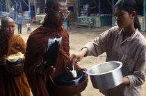 Myanmar, Kyaiktiyo, Monks receiving alms.
