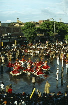 India, Rajasthan, Jaipur, Crowds watching traditional dance at Teej Festival celebrating the onset of the monsoon.