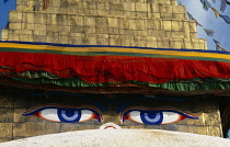 Nepal, Kathmandu Valley, Bodhnath, Detail of stupa showing painted eyes of Buddha which includes a third eye between and above the two eyes symbolising the clairvoyant powers of the Buddha.