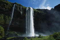 Iceland, Seljalandfoss, Waterfall plunging over mountain side of West Eyjafjoll.