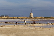 Italy, Sicily, Stagnone, Men working in Stagnone salt pans, Stagnone, near Marsala and Trapani.