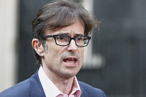 England, London, Westminster, News reporter Robert Peston outside Downing Street.