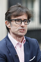 England, London, Westminster, News reporter Robert Peston outside Downing Street.