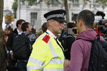 England, London, Westminster, Brexit demonstrations, protestor recording policeman with mobile phone.