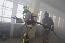 England, Kent, Sevenoaks, Fire and Rescue team on training exercise, breathing aparatus.