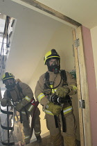 England, Kent, Sevenoaks, Fire and Rescue team on training exercise, breathing aparatus.