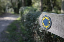 England, East Sussex, Wooden public bridleway sign in the countryside.