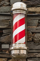 England, Cumbria, Keswick, Barbers pole, barbers shop sign.