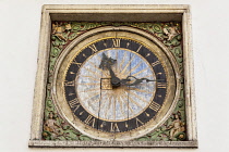 Estonia, Tallinn, Clock on exterior wall of Church of the Holy Ghost.