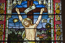 Norway, Oslo, Stained glass window of Christs crucifixion.
