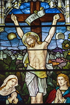 Norway, Oslo, Stained glass window of Christs crucifixion.