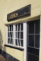 England, Somerset, Dunster, Building with extremely crooked window.