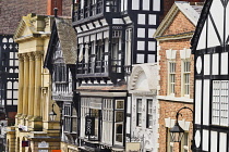 England, Cheshire, Chester, Row of buildings with a mix of architectural styles on Eastgate Street.