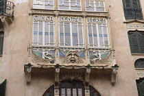 Spain, Balearic Islands, Majorca, Palma, Art Nouveau grotesque face on Dental Clinic in the Old City.