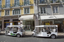Portugal, Estremadura, Lisbon, Chiado, Tuk Tuks parked on Rua Garrett.