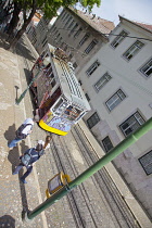 Portugal, Estremadura, Lisbon, Bairro Alto, Elevador da Gloria, Funicular railway tram covered in graffiti.