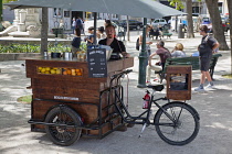 Portugal, Estremadura, Lisbon, Bairro Alto, Fruit juice vendor in Sao Pedro de Alcantara gardens.