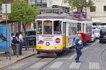 Portugal, Estredmadura, Lisbon, Alfama district, Tram approaching stop at Miradouro das Portas do Sol.