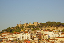 Portugal, Estredmadura, Lisbon, Bairro do Castello, Castelo de Sao Jorge, St Georges castle seen at sunset from Chiado.