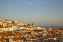 Portugal, Estredmadura, Lisbon, Alfama district, rooftops seen at sunset from Chiado.