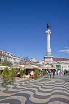 Portugal, Estremadura, Lisbon, Baixa, Praca Rossio with statue of King Pedro IV in the centre of the square.