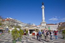 Portugal, Estremadura, Lisbon, Baixa, Praca Rossio with statue of King Pedro IV in the centre of the square.