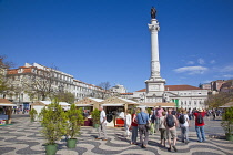 Portugal, Estremadura, Lisbon, Baixa, Praca Rossio with statue of King Pedro IV in the centre of the square.