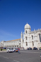 Portugal, Estredmadura, Lisbon, Belem, Mosterio Dos Jeronimos, Exterior of the monastery with Tuk Tuks parked.