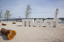 Portugal, Estredmadura, Lisbon, Belem, MAAT sign outside Museum of Art, Architecture and Technology on the banks of the river Tagus.