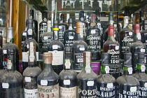 Portugal, Estremadura, Lisbon, Baixa district, Window display of Port wines.