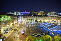 Portugal, Estredmadura, Lisbon, Baixa, Praca da Figueira, Tram parked at night.