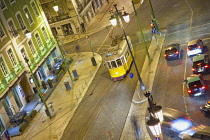 Portugal, Estredmadura, Lisbon, Baixa, Praca da Figueira, Tram parked at night.