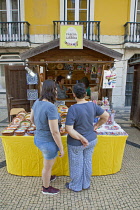 Portugal, Estremadura, Lisbon, Baixa district, Wooden chalet stall selling tourist goods.