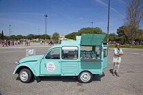 Portugal, Estredmadura, Lisbon, Belem, Citroen 2CV van and vendor selling sweet gifts.