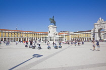 Portugal, Estremadura, Lisbon, Baixa, Praca do Comercio, Segway guided tour of the square with equestrian statue of King Jose and Rua Augusta triumphal arch.