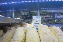 Portugal, Estremadura, Lisbon, Baixa, Display of local pastries.