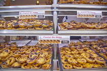 Portugal, Estremadura, Lisbon, Baixa, Display of custard cakes and pastries.