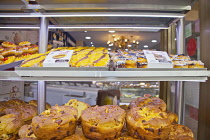 Portugal, Estremadura, Lisbon, Baixa, Display of custard cakes and pastries.