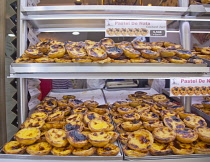 Portugal, Estremadura, Lisbon, Baixa, Display of custard cakes and pastries.