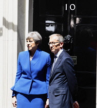 England, London, Theresa May in Downing Street after the 2017 election with husband Philip May on the steps of number 10.