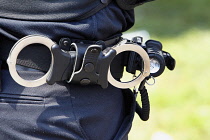 Law & Order, Police officers belt with handcuffs.