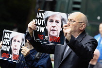 Law & Order, Protester in Westminster holding anti theresa May poster 2017, London, England.