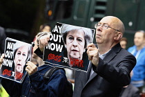 Law & Order, Protester in Westminster holding anti theresa May poster 2017, London, England.